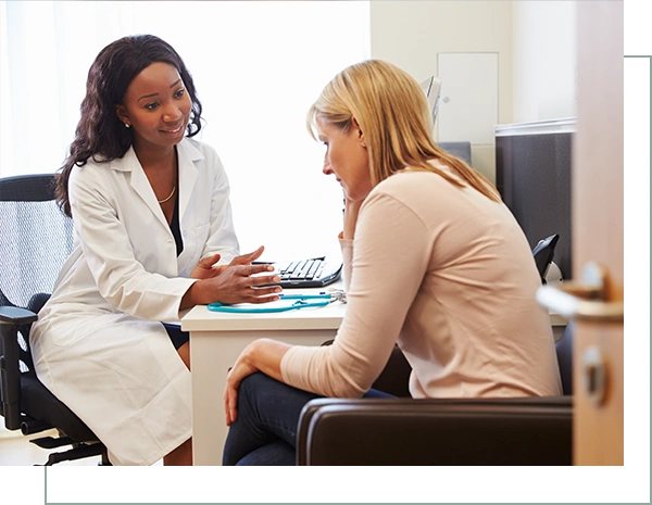 Female Doctor Treating Patient Suffering With Depression