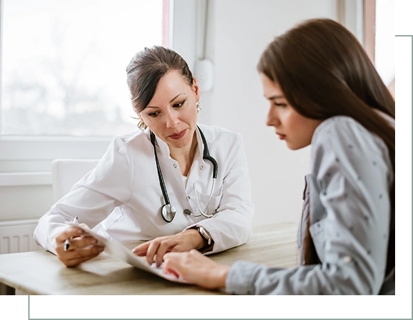 female doctor giving advice to a female patient
